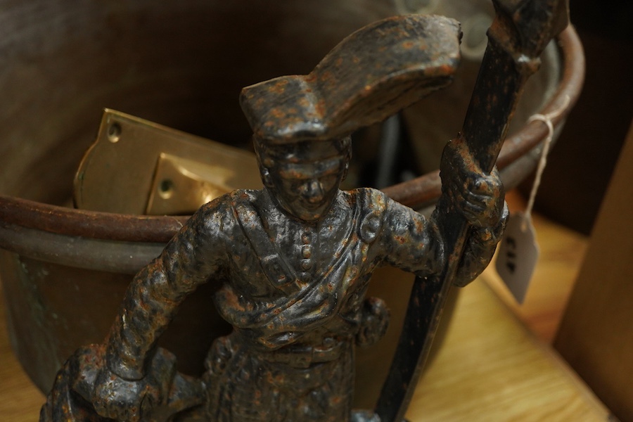 A collection of metalware to include a Victorian copper pan, a figural cast iron doorstop- 39cm high, brass door handles etc